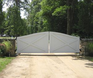 Solid wood ranch-style driveway gate by Tri State Gate, New York