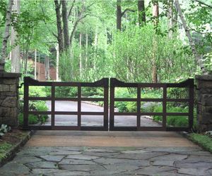 Modern meets vintage wooden gate design by Tri State Gate, New York