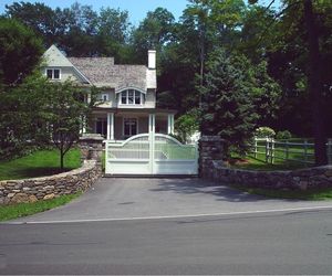 Small, residential automatic driveway gate by Tri State Gate, New York