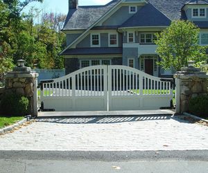 Traditional design swinging automatic gate by Tri State Gate, New York