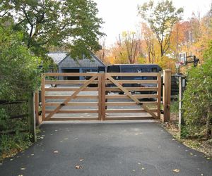 Small wooden automatic driveway gate by Tri State Gate