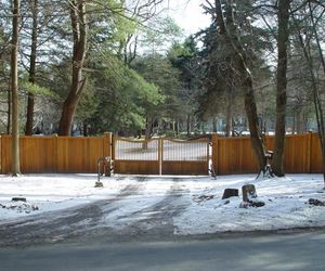 Cedarwood automated gate with secure entry by Tri State Gate, New York
