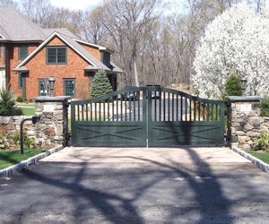 Forest green ranch/farm style driveway gate by Tri State Gate, New York