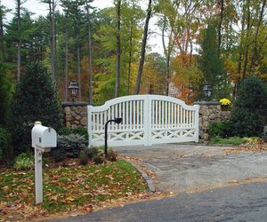 Unique ranch-style gate with keypad entry by Tri State Gate, New York