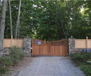 Automated cedar wood driveway gate by Tri State Gate, New York