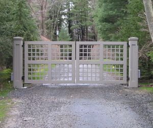 Trellis-style wooden driveway gate by Tri State Gate, New York