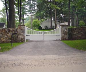 Scalloped wood driveway gate with keypad entry by Tri State Gate, New York