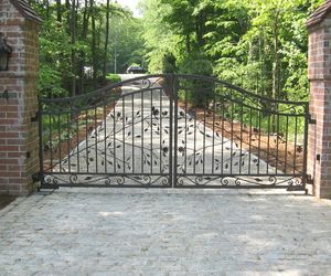Custom wrought-iron flower-and-vine driveway entrance gate by Tri State Gate, New York