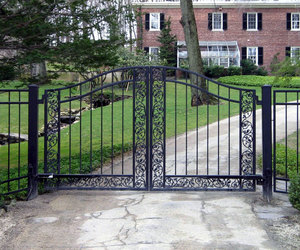 Custom wrought-iron driveway gate design with ivy and vine details by Tri State Gate, New York