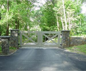 Gray painted wood entrance gate with a unique design by Tri State Gate, New York