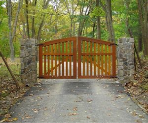 Cedar wood automatic driveway swing gate by Tri State Gate, New York