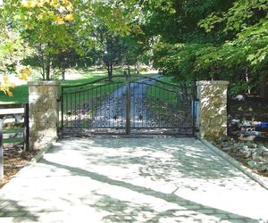 Ornamental wrought-iron driveway gate by Tri State Gate in Bedford Hills, New York