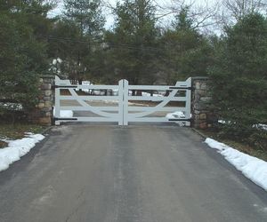 Unique wooden driveway gate design by Tri State Gate, New York