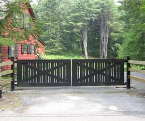 Modern ranch design wooden automated swing gate by Tri State Gate, New York