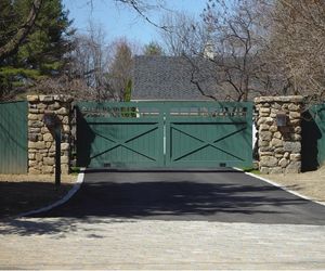 Solid wood painted driveway gate with automated swing doors, by Tri State Gate, New York